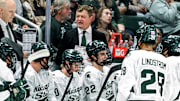 Michigan State's head coach Adam Nightingale, center, talks with the team during a break in the action in the first period of the game against New Hampshire on Thursday, Oct. 9, 2025, at Munn Ice Arena in East Lansing.