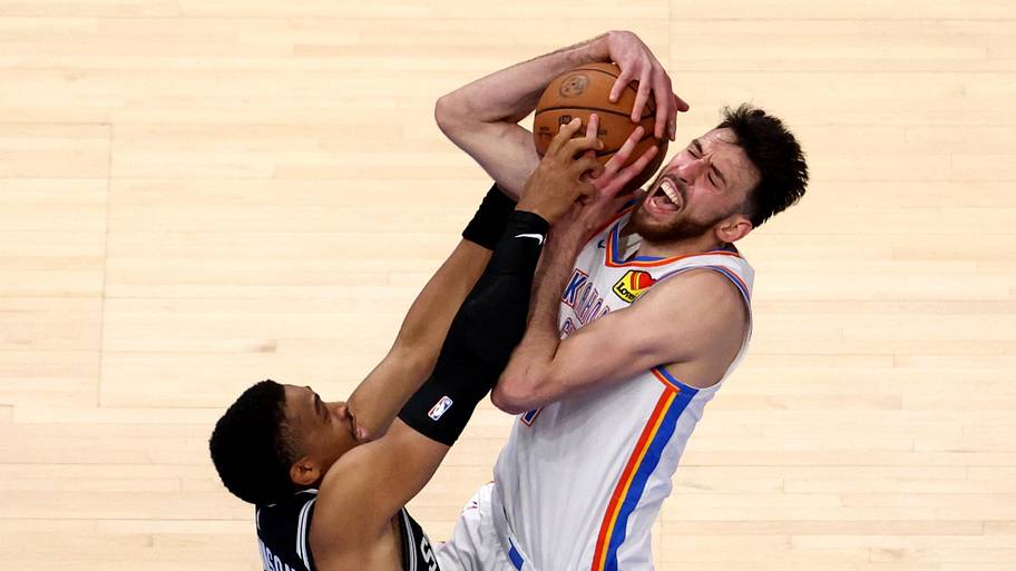 Spurs forward Keldon Johnson defends Thunder center Chet Holmgren in Game 5 of the Western Conference finals.