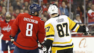 Nov 7, 2018; Washington, DC, USA; Pittsburgh Penguins center Sidney Crosby (87) and Washington Capitals left wing Alex Ovechkin (8) talk with referee Wes McCauley (4) in the third period at Capital One Arena. Mandatory Credit: Geoff Burke-Imagn Images