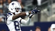 Dallas Cowboys wide receiver Ceedee Lamb (88) celebrates after a play against the Washington Commanders during the first quarter of the game at AT&T Stadium. 
