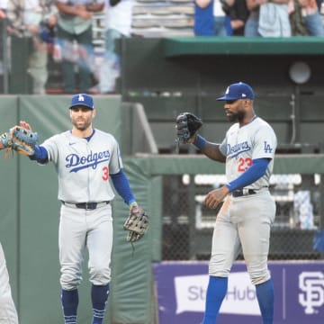 Jun 29, 2024; San Francisco, California, USA; Los Angeles Dodgers catcher Will Smith (16) and outfielder Chris Taylor (3) and outfielder Jason Heyward (23) celebrate after defeating the San Francisco Giants at Oracle Park. Mandatory Credit: Ed Szczepanski-USA TODAY Sports