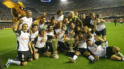 Valencia celebrate with the two cups aft