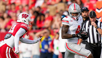 Ohio State Buckeyes wide receiver Jeremiah Smith (4) runs the ball during the game against the Wisconsin Badgers at Camp Randall Stadium on Saturday, Oct. 18, 2025 in Madison, Wisconsin.