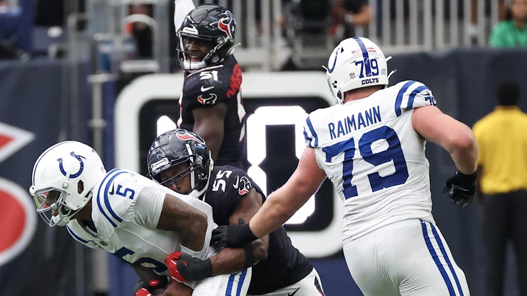Oct 27, 2024; Houston, Texas, USA; Indianapolis Colts quarterback Anthony Richardson (5) is tackled by Houston Texans defensive end Danielle Hunter (55) in the second half at NRG Stadium. Mandatory Credit: Thomas Shea-Imagn Images