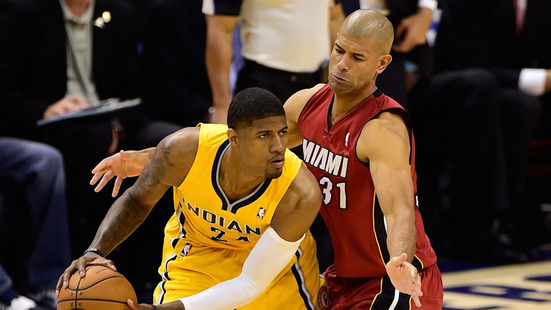 May 18, 2014; Indianapolis, IN, USA; Indiana Pacers forward Paul George (24) looks to pass the ball around Miami Heat forward Shane Battier (31) during the second half of game one of the Eastern Conference Finals of the 2014 NBA Playoffs at Bankers Life Fieldhouse. Indiana Pacers beat Miami Heat 107 to 96.  Mandatory Credit: Marc Lebryk-Imagn Images