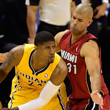 May 18, 2014; Indianapolis, IN, USA; Indiana Pacers forward Paul George (24) looks to pass the ball around Miami Heat forward Shane Battier (31) during the second half of game one of the Eastern Conference Finals of the 2014 NBA Playoffs at Bankers Life Fieldhouse. Indiana Pacers beat Miami Heat 107 to 96.  Mandatory Credit: Marc Lebryk-Imagn Images