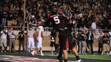 Texas Tech Red Raiders wide receiver Michael Crabtree (5) celebrates his fourth quarter touchdown reception with teammate Eric Morris (12) against the Texas Longhorns at Jones AT&T Stadium. Texas Tech beat Texas 39-33.