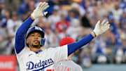 Oct 1, 2025; Los Angeles, California, USA; Los Angeles Dodgers shortstop Mookie Betts (50) celebrates after hitting a double against the Cincinnati Reds in the first inning during game two of the Wildcard round for the 2025 MLB playoffs at Dodger Stadium.