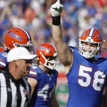 Florida Gators left tackle Austin Barber has a big job ahead of him blocking Miami Hurricanes defensive end Rueben Bain Jr.