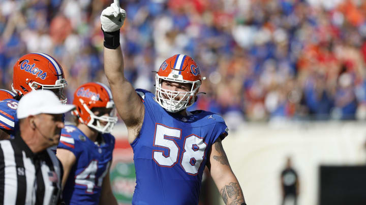 Florida Gators left tackle Austin Barber has a big job ahead of him blocking Miami Hurricanes defensive end Rueben Bain Jr.