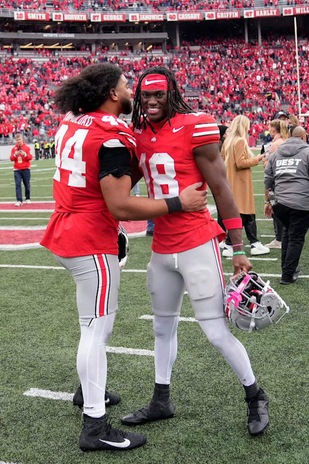 Oct 21, 2023; Columbus, Ohio, USA; Ohio State Buckeyes defensive end JT Tuimoloau (44) and Ohio State Buckeyes wide receiver 