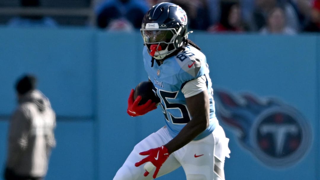 Dec 21, 2025; Nashville, Tennessee, USA; Tennessee Titans tight end Chig Okonkwo (85) runs during the first half against the Kansas City Chiefs at Nissan Stadium.