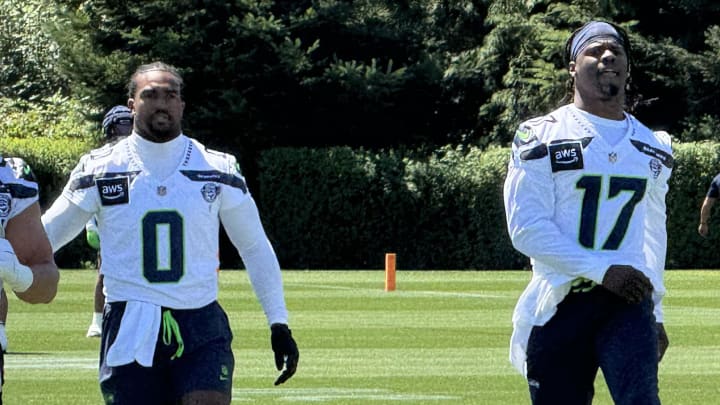 Seattle Seahawks linebackers Tyrel Dodson (0) and Jerome Baker (17) before the start of a training camp practice.