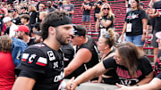 Cincinnati Bearcats quarterback Brendan Sorsby (2) high-fives fans after defeating the Northwestern State Demons 70-0, Saturday, Sept. 13, 2025, at Nippert Stadium in Cincinnati.