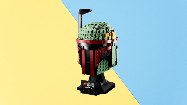 LEGO 'Star Wars' Boba Fett Helmet Building Kit against colorful background.