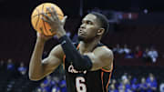 Oklahoma State Cowboys guard Brandon Newman (6) takes a three point shot 