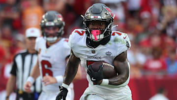 Sep 8, 2024; Tampa, Florida, USA;  Tampa Bay Buccaneers running back Bucky Irving (7) runs with the ball against the Washington Commanders during the second half at Raymond James Stadium. Mandatory Credit: Kim Klement Neitzel-Imagn Images