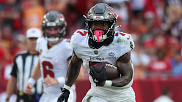 Sep 8, 2024; Tampa, Florida, USA;  Tampa Bay Buccaneers running back Bucky Irving (7) runs with the ball against the Washington Commanders during the second half at Raymond James Stadium. Mandatory Credit: Kim Klement Neitzel-Imagn Images