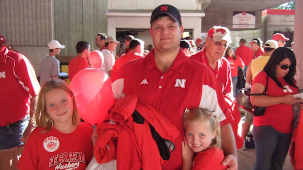 Scott Cyboron with his two daughters, attending a game at Memorial Stadium in September of 2009. 