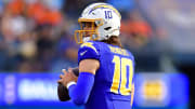 Dec 10, 2023; Inglewood, California, USA; Los Angeles Chargers quarterback Justin Herbert (10) drops back to pass against the Denver Broncos during the first half at SoFi Stadium. Mandatory Credit: Gary A. Vasquez-USA TODAY Sports