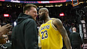 Feb 20, 2025; Portland, Oregon, USA; Los Angeles Lakers forward LeBron James (23) celebrates with guard Luka Doncic (77) and forward Rui Hachimura (28) after beating the Portland Trail Blazers at Moda Center. Mandatory Credit: Troy Wayrynen-Imagn Images