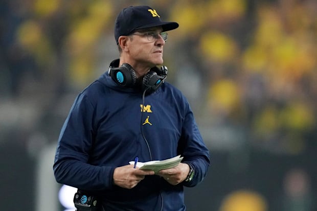 Michigan head coach Jim Harbaugh looks on during second half of the College Football Playoff national championship game.
