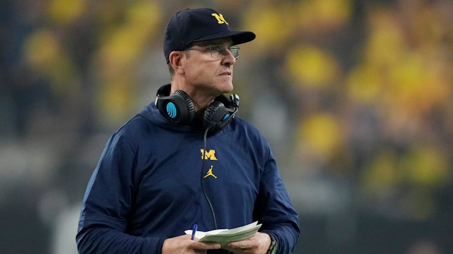 Michigan head coach Jim Harbaugh looks on during second half of the College Football Playoff national championship game.