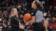 Nov 10, 2024; Charlotte, NC, USA; Virginia Tech Hokies head coach Megan Duffy talks to the official during the first half against the Iowa Hawkeyes at Spectrum Center. Mandatory Credit: Jim Dedmon-Imagn Images
