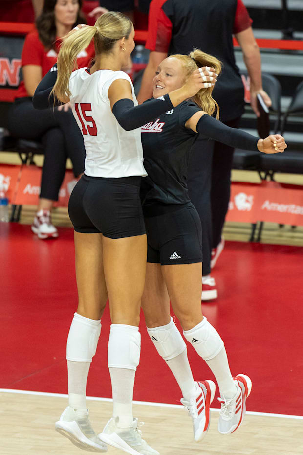 Nebraska middle blocker Andi Jackson and DS/Libero Olivia Mauch get fired up before the Red-White Scrimmage on Saturday.