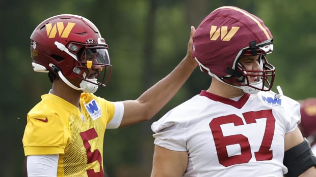 Washington Commanders quarterback Jayden Daniels and offensive lineman Nick Allegretti.