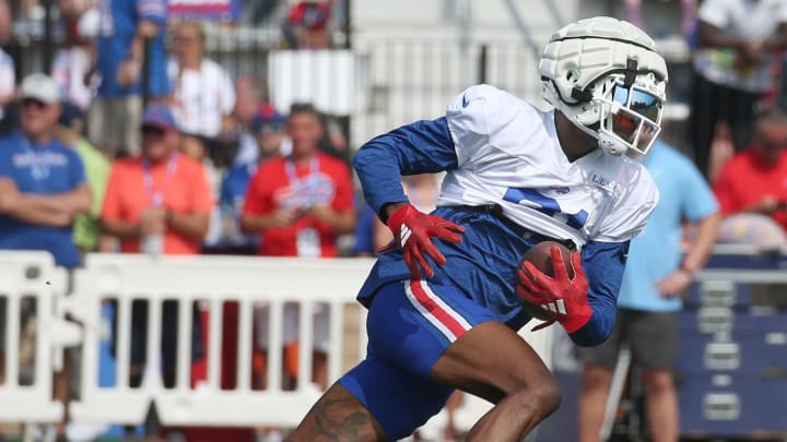 Bills wide receiver Marquez Valdes-Scantling pulls in a pass and races upfield during route drills.