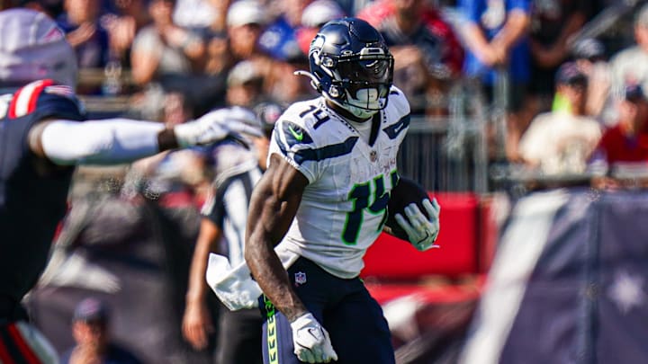 Sep 15, 2024; Foxborough, Massachusetts, USA; Seattle Seahawks wide receiver DK Metcalf (14) runs the ball against the New England Patriots in the second half at Gillette Stadium.