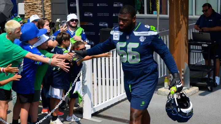 Jul 27, 2024; Renton, WA, USA;  Seattle Seahawks guard McClendon Curtis (66) runs out of the locker room before training camp at Virginia Mason Athletic Center.