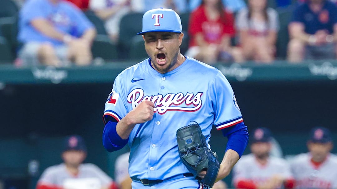 Mar 30, 2025; Arlington, Texas, USA; Texas Rangers relief pitcher Luke Jackson (77) reacts after recording the last out against the Boston Red Sox at Globe Life Field. 