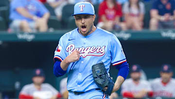 Mar 30, 2025; Arlington, Texas, USA; Texas Rangers relief pitcher Luke Jackson (77) reacts after recording the last out against the Boston Red Sox at Globe Life Field.
