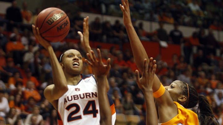 Jan 25, 2009; Auburn, AL, USA; Auburn Tigers guard DeWanna Bonner (24) shoots over Tennessee Volunteers forward Alex Fuller (2) and forward Glory Johnson (25) at Beard-Eaves Memorial Coliseum. Mandatory Credit: John Reed-Imagn Images Jan 25, 2009; Auburn, AL, USA; Auburn Tigers guard DeWanna Bonner (24) shoots over Tennessee Volunteers forward Alex Fuller (2) and forward Glory Johnson (25) at Beard-Eaves Memorial Coliseum. Mandatory Credit: John Reed-Imagn Images