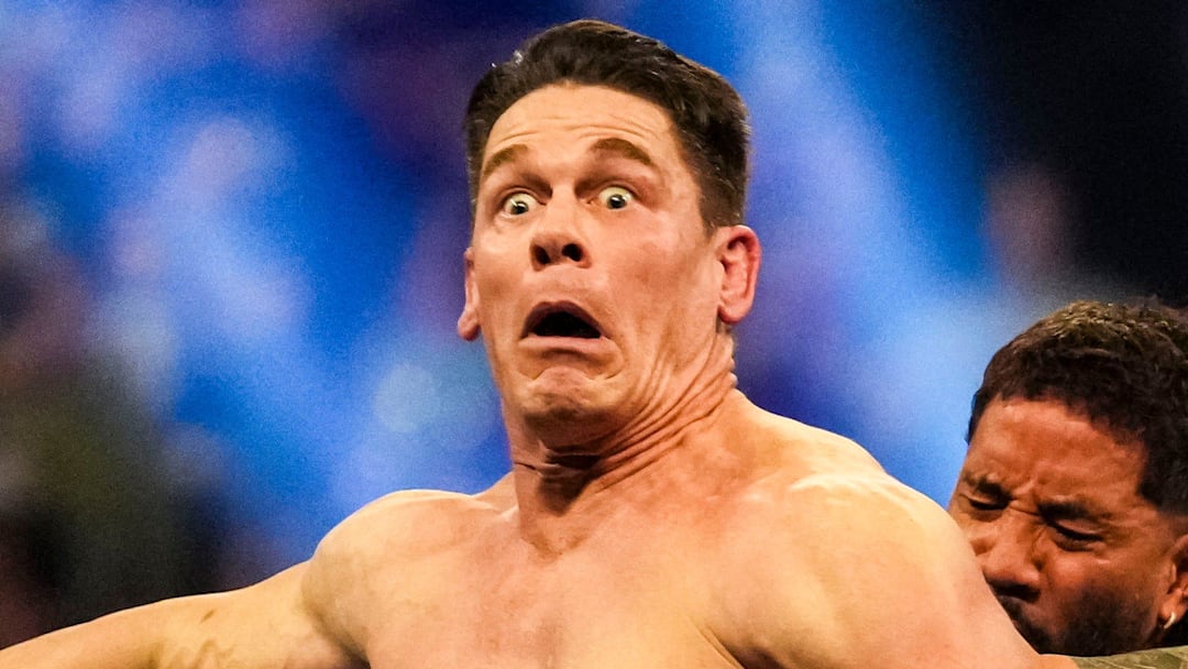 Jey Uso pushes John Cena off the ring Saturday, Feb. 1, 2025, during the WWE Royal Rumble at Lucas Oil Stadium in Indianapolis.