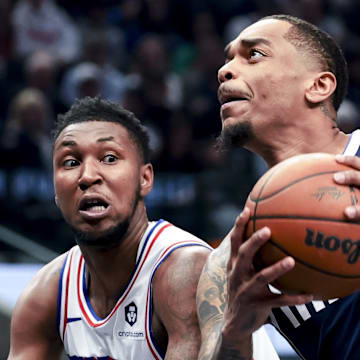 Mar 16, 2025; Dallas, Texas, USA;  Dallas Mavericks forward P.J. Washington (25) drives to the basket as Philadelphia 76ers forward Justin Edwards (19) defends during the first half at American Airlines Center. Mandatory Credit: Kevin Jairaj-Imagn Images