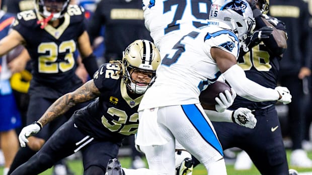 New Orleans Saints safety Tyrann Mathieu (32) forces a fumble during a run by Carolina Panthers receiver Jonathan Mingo (15) 