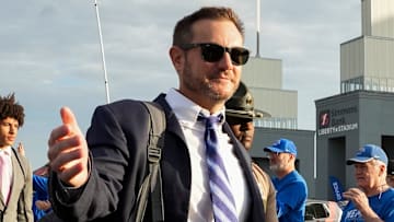 Memphis' head coach Ryan Silverfield walks over to high five a fan during the “Tiger Walk” into the stadium before the game between USF and Memphis at Simmons Bank Liberty Stadium in Memphis, Tenn., on October 25, 2025.
