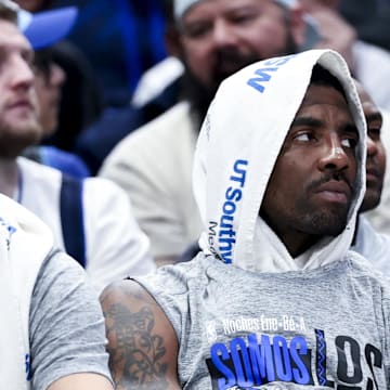 Mar 1, 2025; Dallas, Texas, USA;  Dallas Mavericks guard Kyrie Irving (right) and Dallas Mavericks guard Klay Thompson (31) react on the bench against the Milwaukee Bucks during the second half at American Airlines Center. Mandatory Credit: Kevin Jairaj-Imagn Images