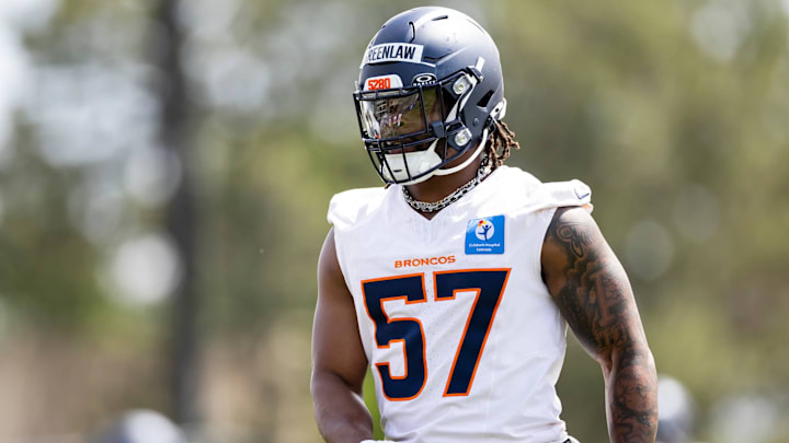 Denver Broncos linebacker Dre Greenlaw (57) works out during mandatory minicamp. Denver Broncos linebacker Dre Greenlaw (57) works out during mandatory minicamp.