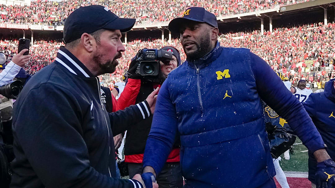 Ohio State Buckeyes head coach Ryan Day shakes hands with Michigan Wolverines head coach Sherrone Moore Ohio State Buckeyes head coach Ryan Day shakes hands with Michigan Wolverines head coach Sherrone Moore