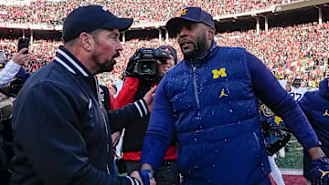 Ohio State Buckeyes head coach Ryan Day shakes hands with Michigan Wolverines head coach Sherrone Moore