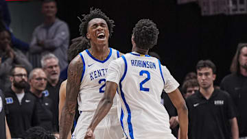 Nov 12, 2024; Atlanta, Georgia, USA; Kentucky Wildcats center Amari Williams (22) reacts with guard Jaxson Robinson (2) against the Duke Blue Devils during the second half at State Farm Arena. Mandatory Credit: Dale Zanine-Imagn Images
