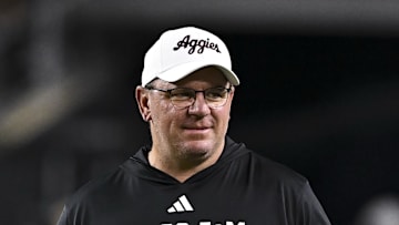 Nov 16, 2024; College Station, Texas, USA; Texas A&M Aggies head coach Mike Elko walks on the field prior to the game against the New Mexico State Aggies at Kyle Field. Mandatory Credit: Maria Lysaker-Imagn Images 