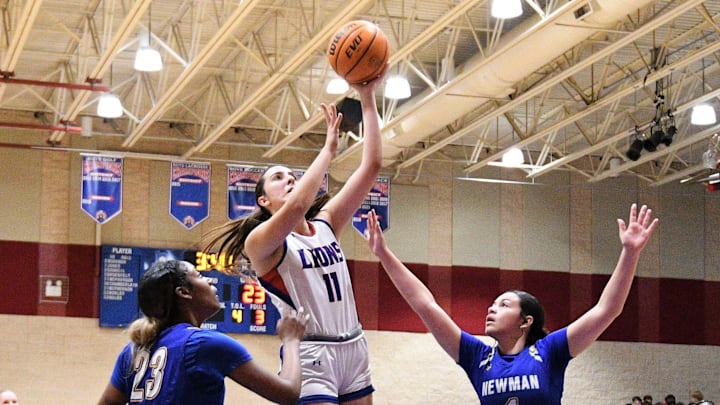 King's Academy's Sophia Kateris extends for a layup attempt during the first half of the Lions' district championship win over Cardinal Newman on Feb. 3 2023.

Sophia Kateris