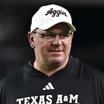 Nov 16, 2024; College Station, Texas, USA; Texas A&M Aggies head coach Mike Elko walks on the field prior to the game against the New Mexico State Aggies at Kyle Field. Mandatory Credit: Maria Lysaker-Imagn Images 