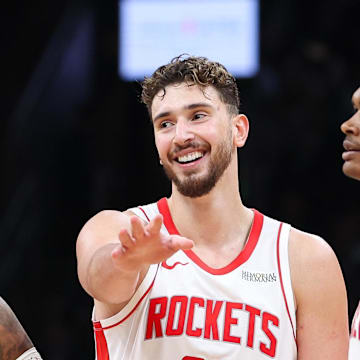 Nov 1, 2025; Boston, Massachusetts, USA; Houston Rockets forward Jabari Smith (10) and center Alperen Sengun (28)  celebrate during the second half against the Boston Celtics at TD Garden. Mandatory Credit: Paul Rutherford-Imagn Images