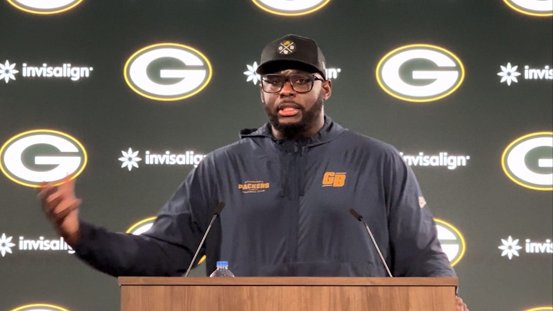 Packers defensive line coach Vince Oghobaase 